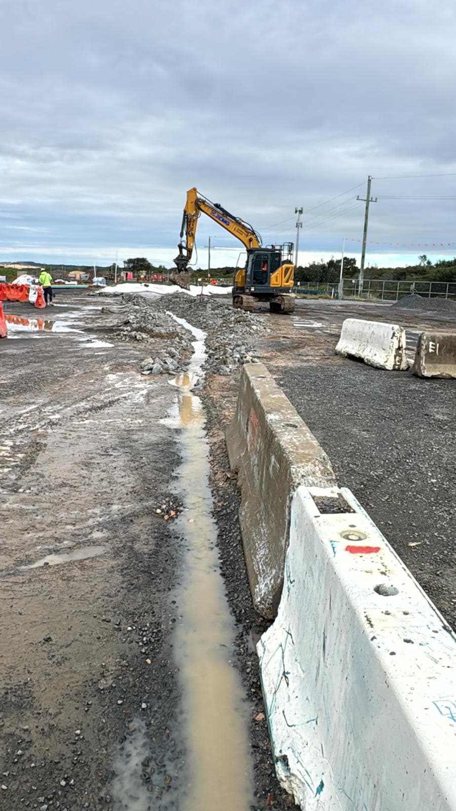 Civil project site access and wet-weather work environment photo supplied by Sagona Bros, used as contextual image material for the HSEQ, ISO certification and project-readiness case study.