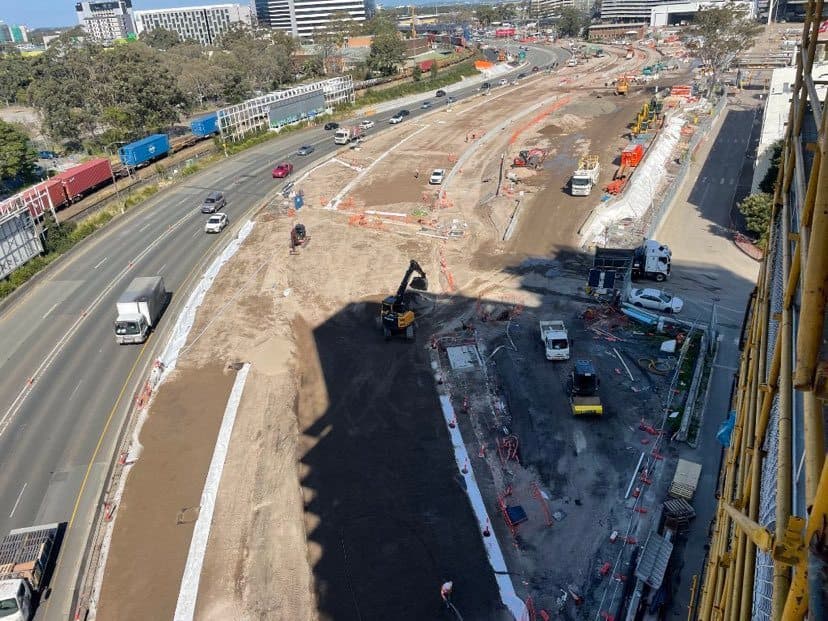 Elevated view of Sydney Gateway road corridor works with traffic lanes, plant equipment, vehicles and construction zones.
